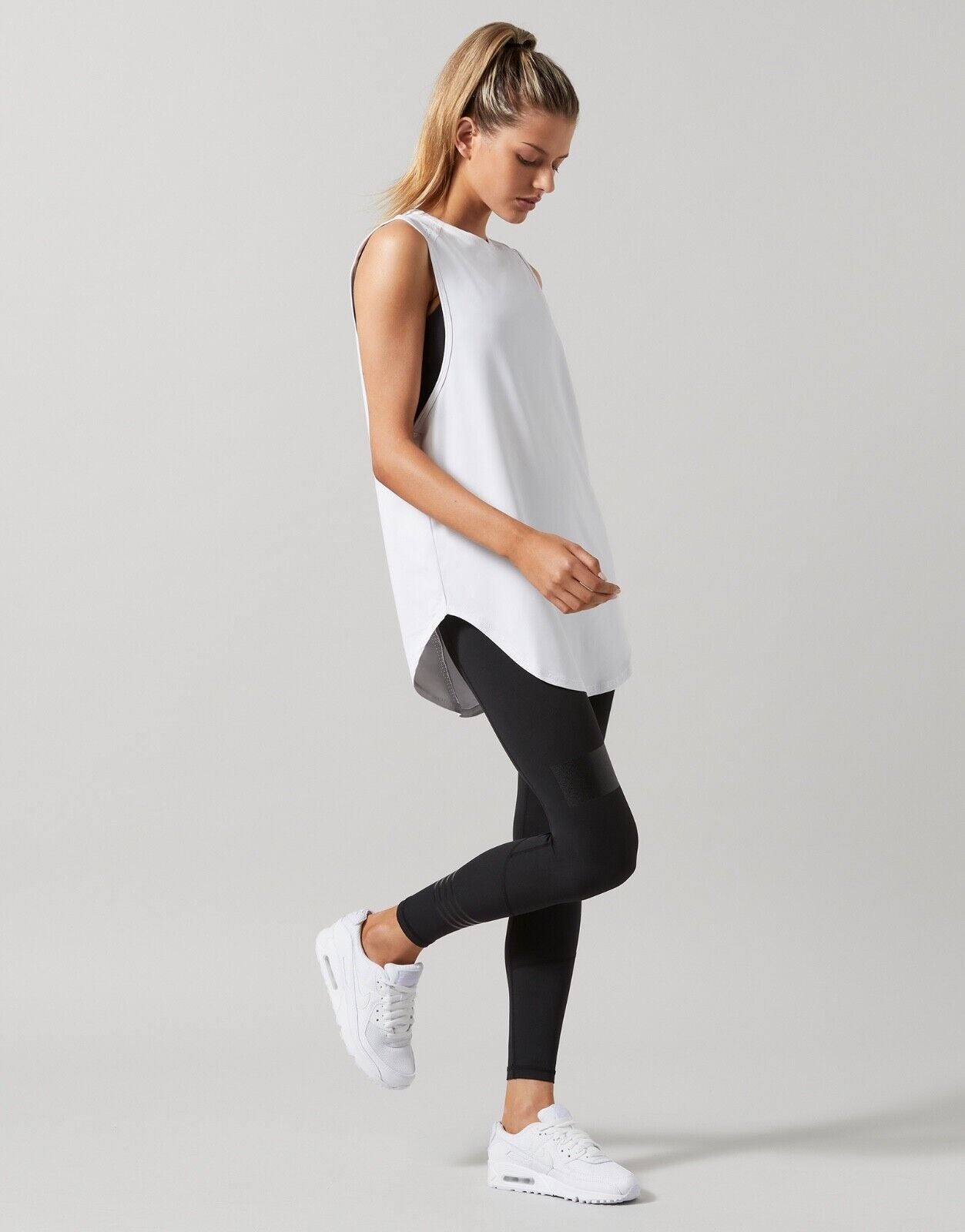 Lilybod Lily Activewear Muscle Tank White. Full body side image.