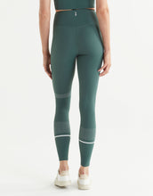 Green leggings with white accents on a white background
