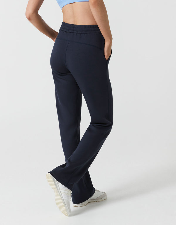Navy blue sweatpants worn by a woman