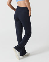 Navy blue sweatpants worn by a woman