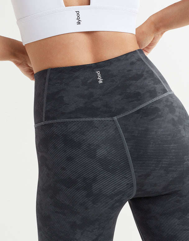 Close up of black stucco leggings on a white background