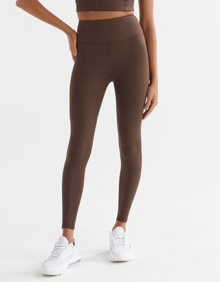 A woman wearing Lilybod Astrid Oak leggings.
