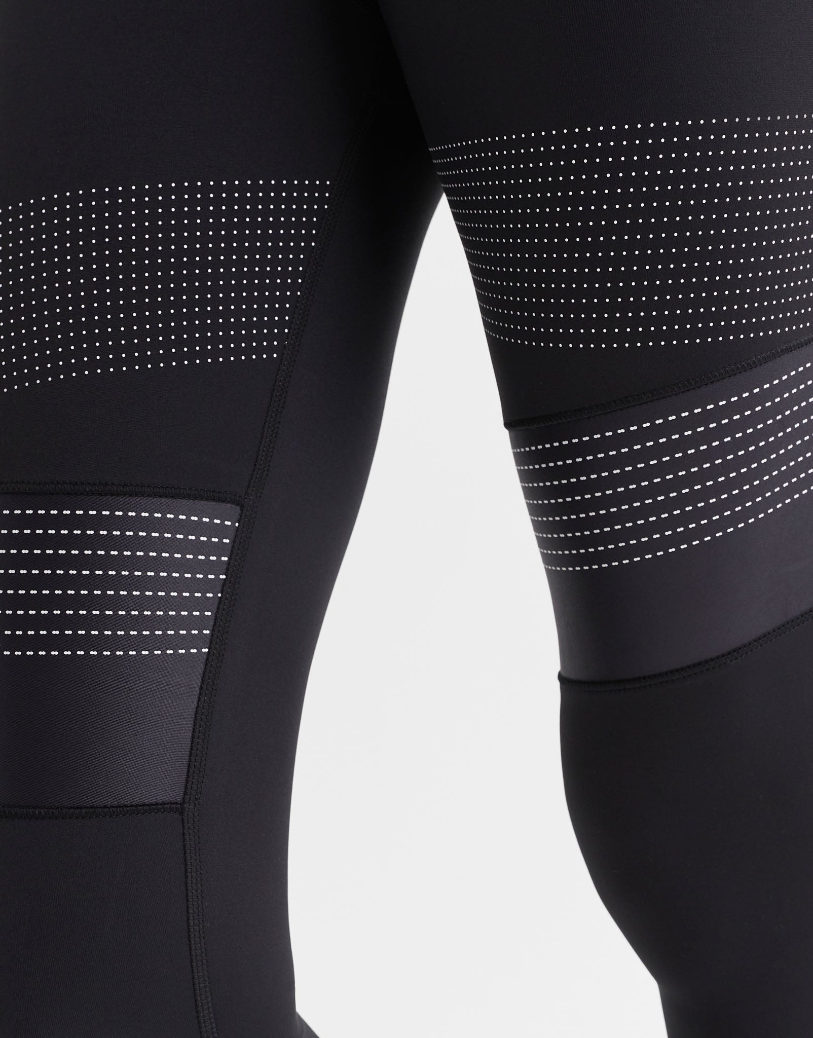 Close up of black leggings with a micro dot print design.