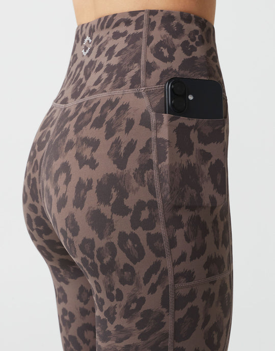 Leopard print leggings with a pocket on a white background
