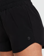 Black shorts with a brand logo on a white background