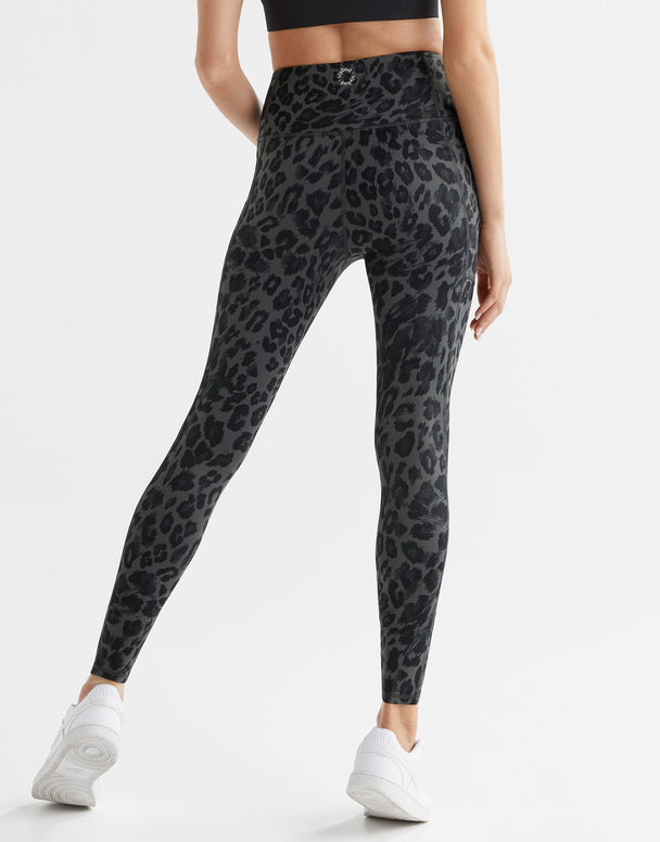 Grey leopard print leggings worn by a woman.