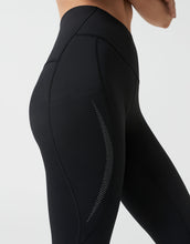 Black athletic leggings with mesh panels on a light gray background