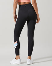 Black leggings with colorful design on a gray background