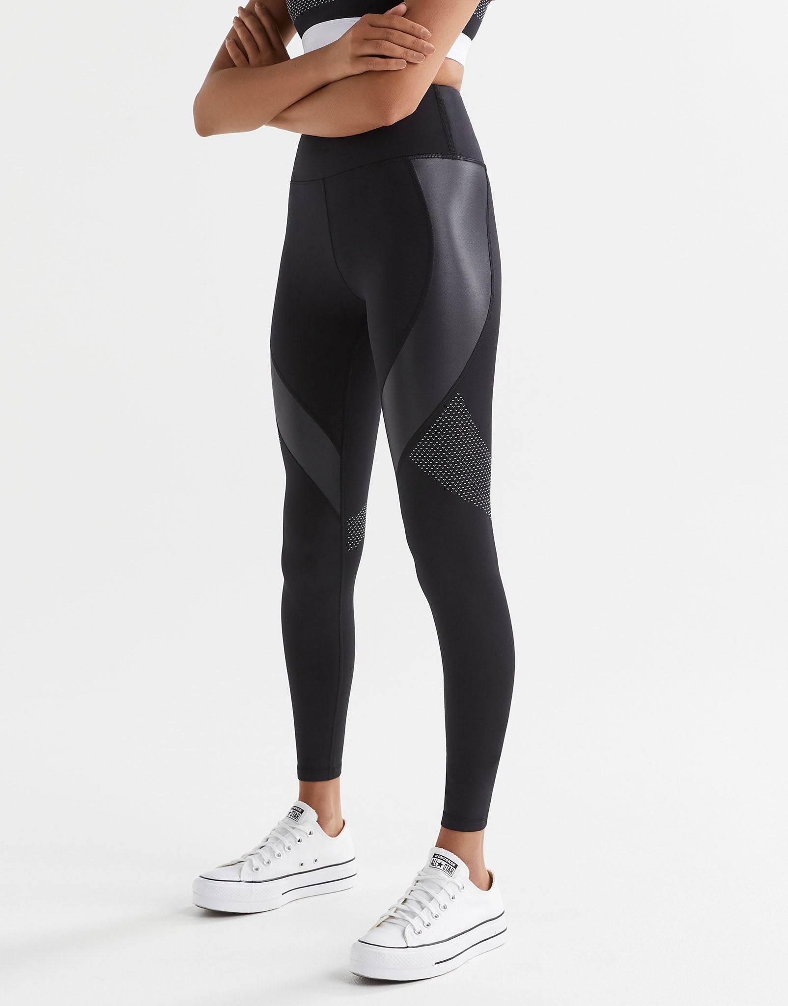 Black leggings with geometric design on a white background