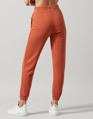 Copper wash sweatpants on a woman by Lilybod