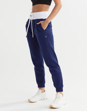 Navy jogger pants with white drawstring and waistband on a white background