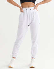 White jogger pants worn by a person on a white background