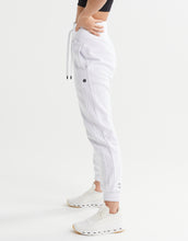 White jogger pants worn by a person on a white background
