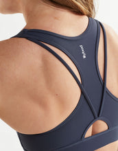 Navy sports bra with brand logo on a white background