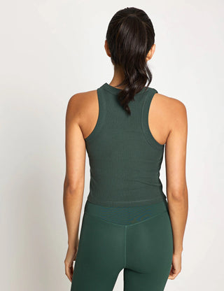Person wearing a green athletic outfit on a light gray background
