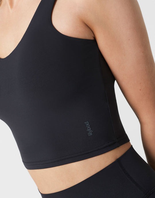 Black athletic top with a brand logo on a white background
