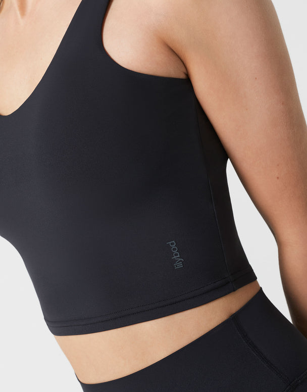 Black athletic top with a brand logo on a white background