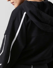 Black hoodie with white stripes on a light gray background