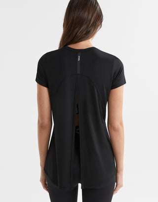 Black t-shirt worn by a person on a white background