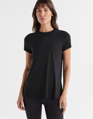 Woman wearing a black t-shirt on a white background