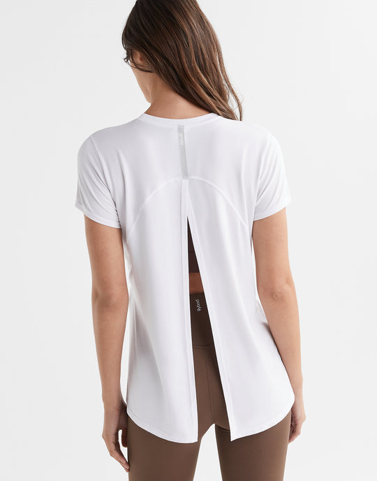 Women wearing a white t shirt with athletic leggings