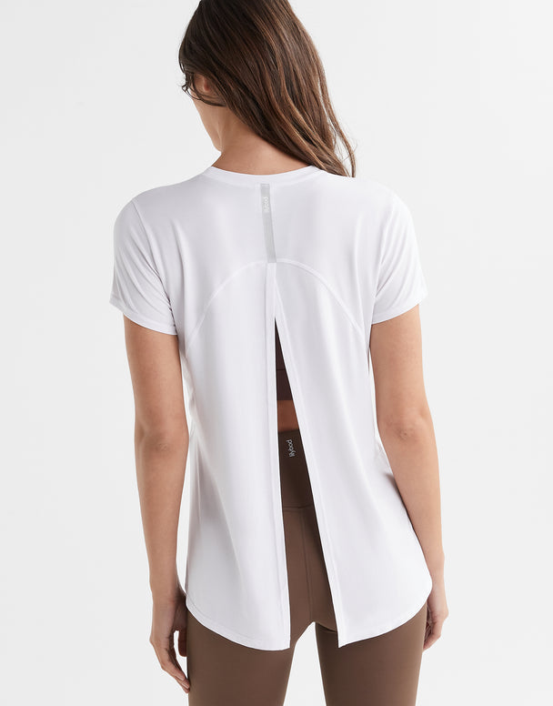 Women wearing a white t shirt with athletic leggings