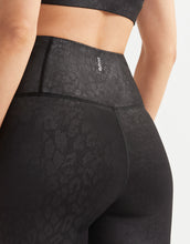 Black High-Shine Leggings on a woman.