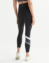 Black leggings with white and grey stripe on a white background