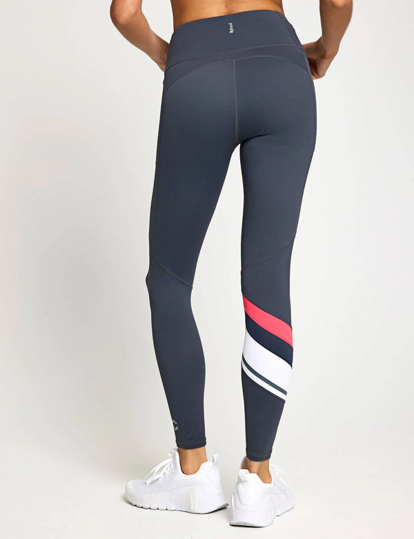 Dark gray leggings with red and white stripes on a white background