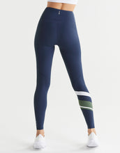 Navy leggings with white and green stripes on a white background