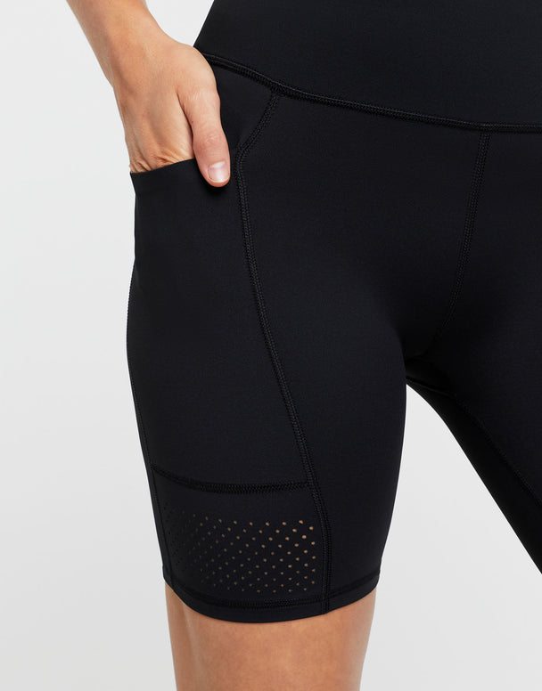 Black athletic shorts with a pocket on a light gray background