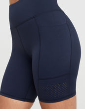 Navy blue activewear shorts with a white background