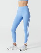 Light blue leggings with white stripes on a white background