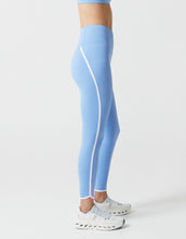 Light blue leggings with white stripes on a white background
