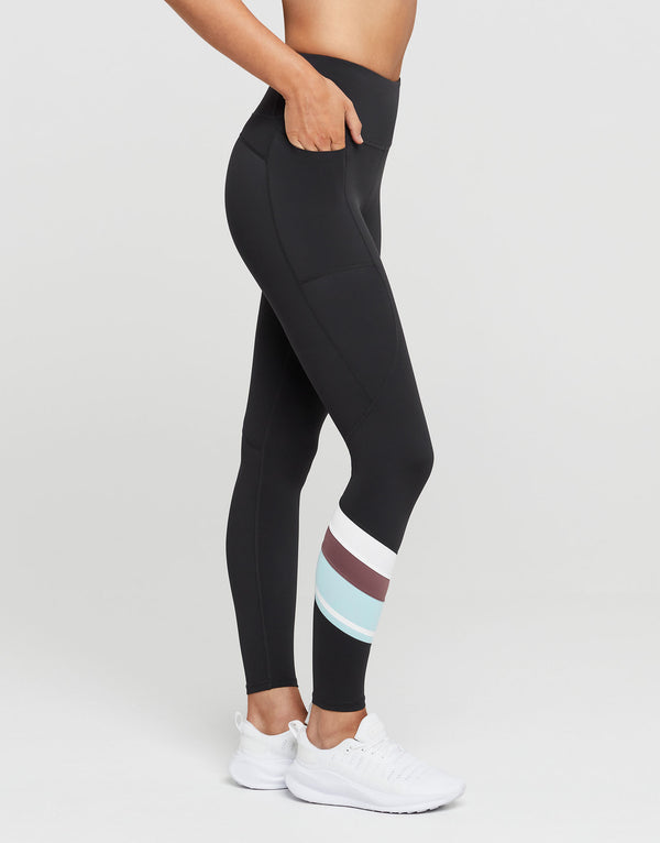 Black leggings with colorful stripe on a white background
