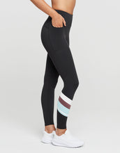 Black leggings with colorful stripe on a white background