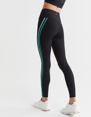Black leggings with green and white stripes on a white background