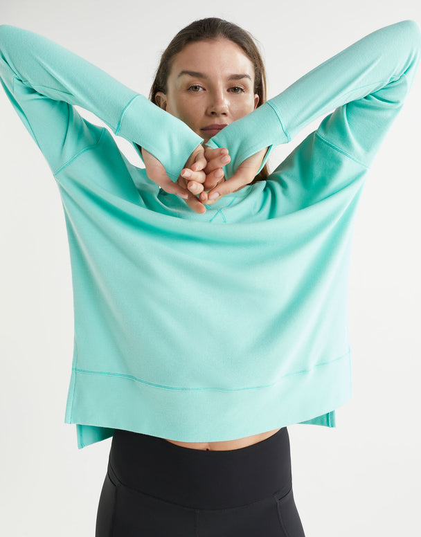 Person wearing a light blue athletic outfit on a white background