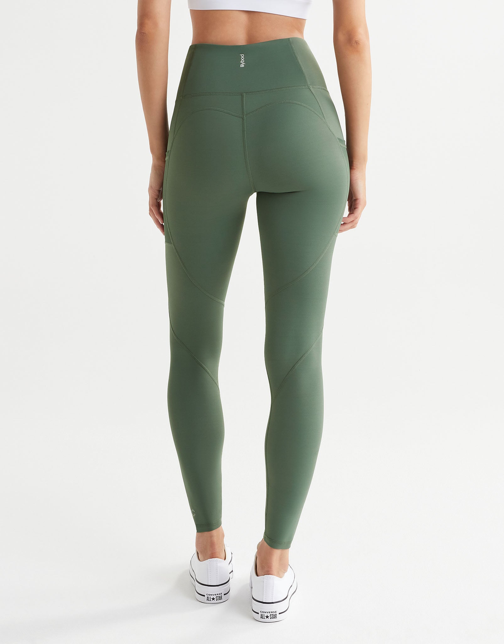 A model wearing army green leggings