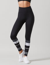 Black leggings with white patterns on a gray background
