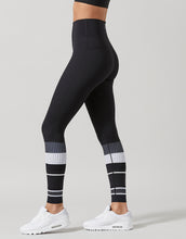 Black leggings with white pattern on a gray background