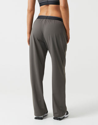 Person wearing gray athletic pants on a white background