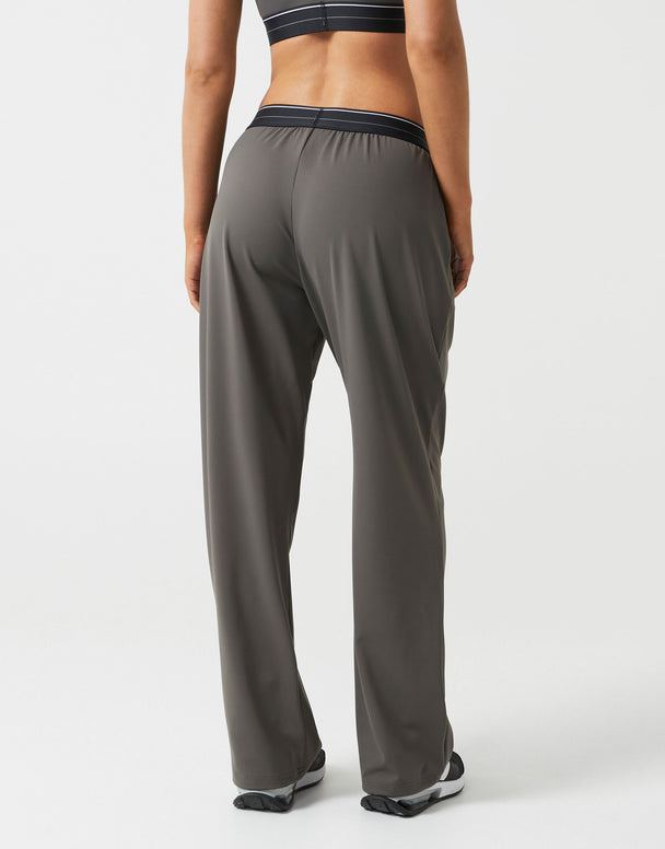 Person wearing gray athletic pants on a white background