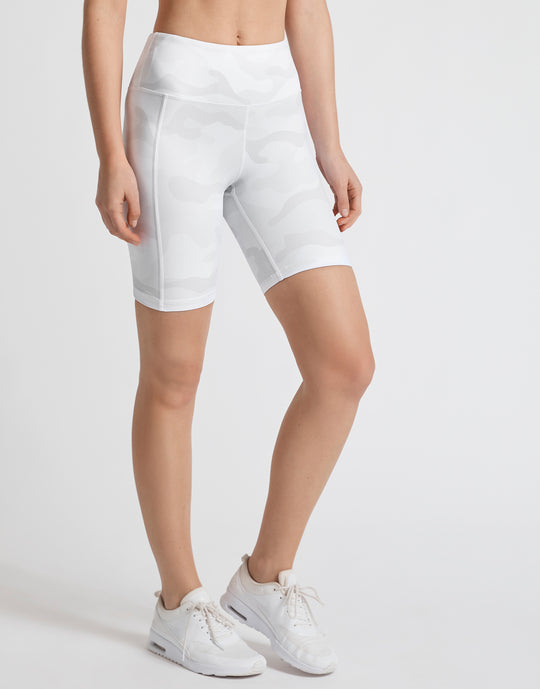 A pair of whispers tan camo bike shorts with back outer leg pockets, designed for high-waist fitting.