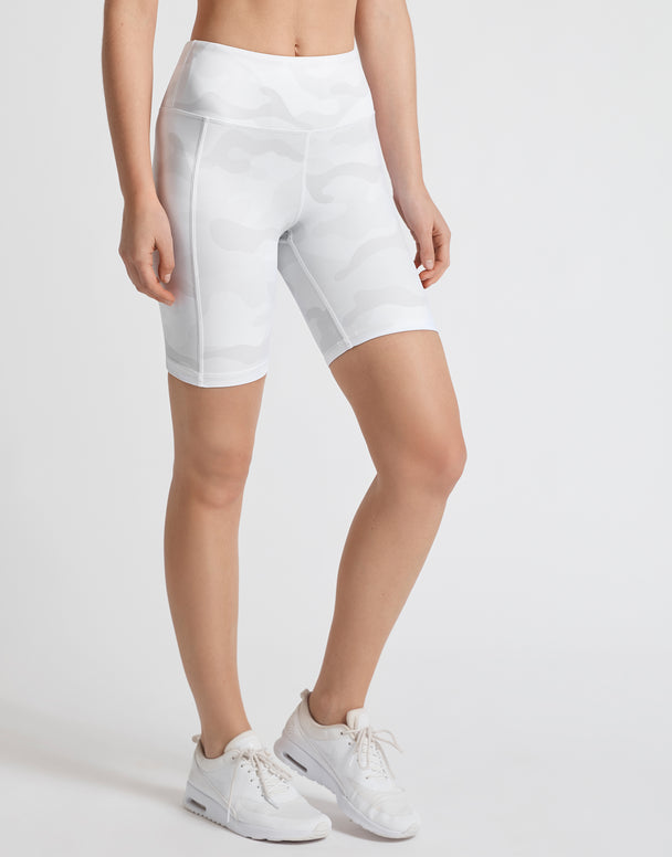 A pair of whispers tan camo bike shorts with back outer leg pockets, designed for high-waist fitting.