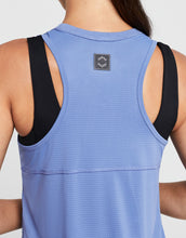 Blue tank top with black straps on a plain background
