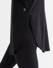 Black outfit with a button detail on a white background