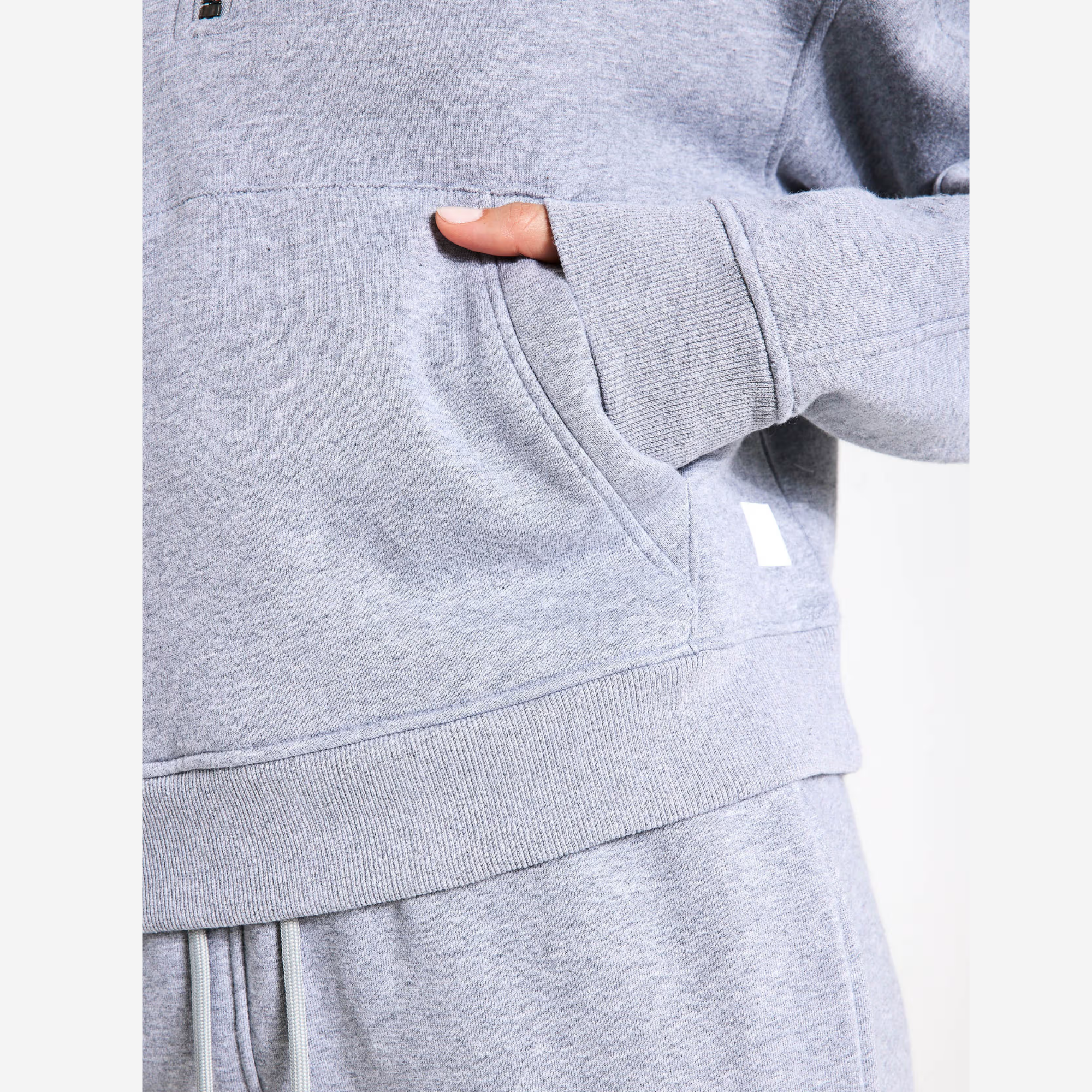 Grey sweater and pants with a white background