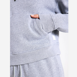 Grey sweater and pants with a white background