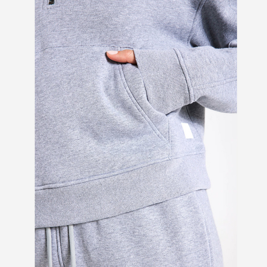 Grey sweater and pants with a white background